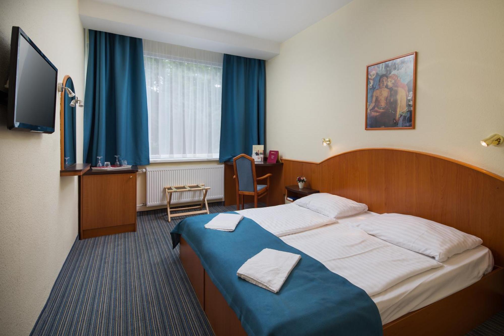 Pokój dwuosobowy typu Economy z 1 lub 2 łóżkami